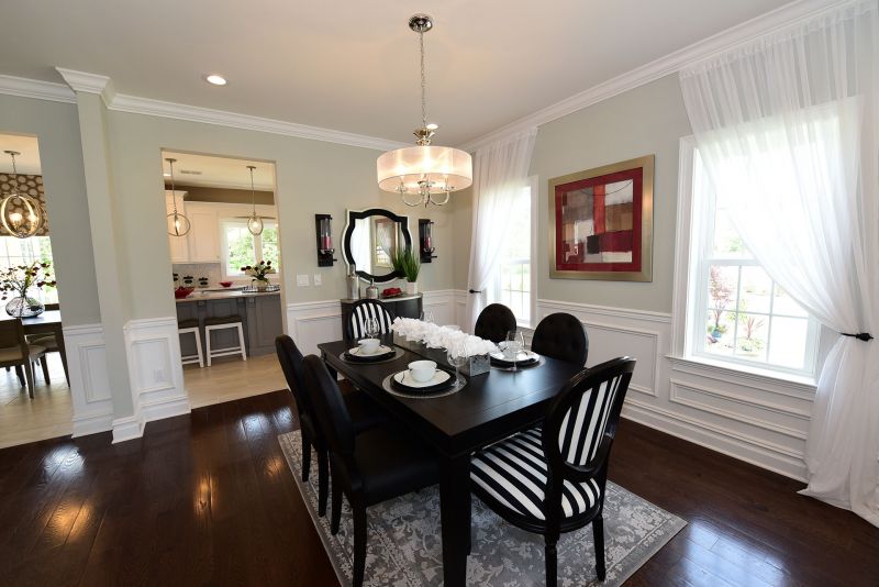 Image of Dining Room featuring 9' ceilings opening to the Living Room on one side and the Kitchen on the other perfect for entertaining
